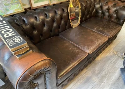 Second hand furniture in Stow on the Wold inside Lee Chinnick's antique shop chesterfield sofa